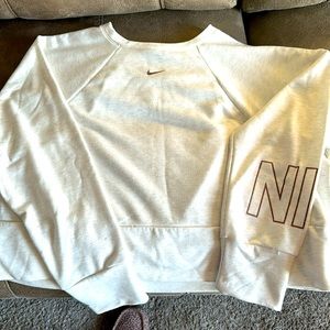 Nike crop sweatshirt with Nike on arm